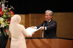 Graduates receiving their diploma
